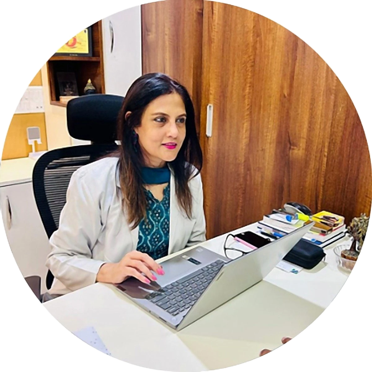 Dr. Rinku Das at her desk in her consulting room