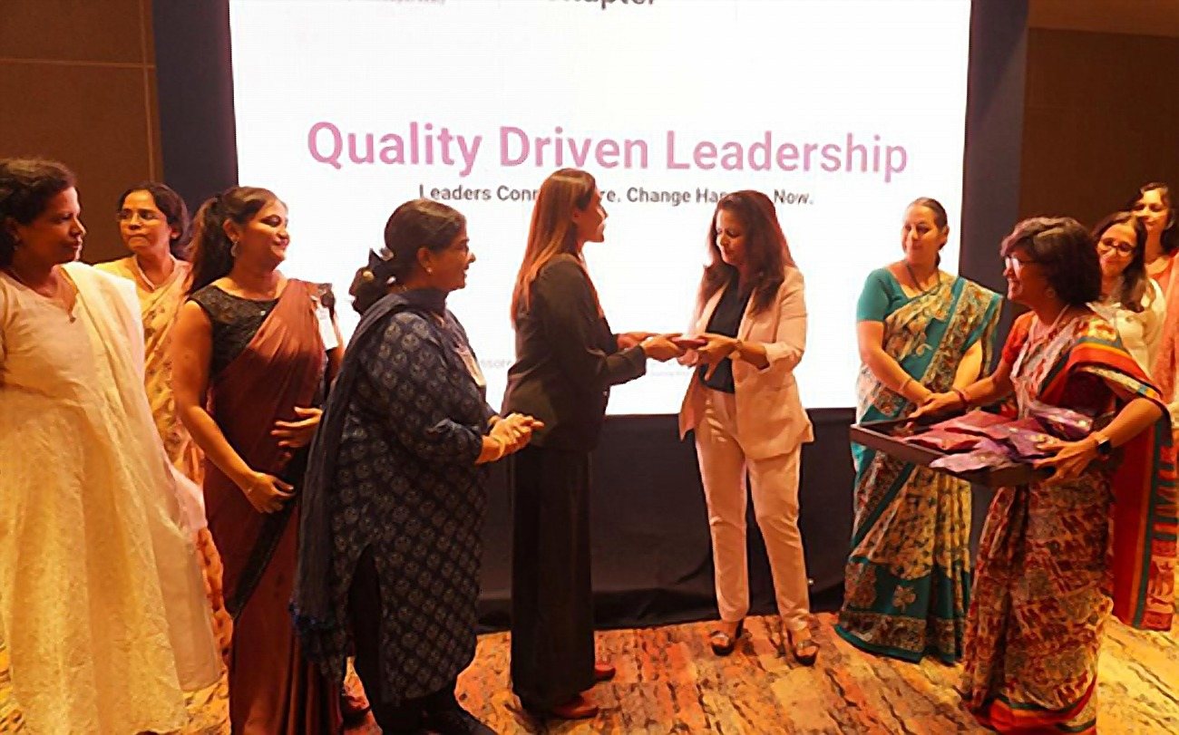 Dr. Rinku Das on stage at the WOS Karnataka Chapter event