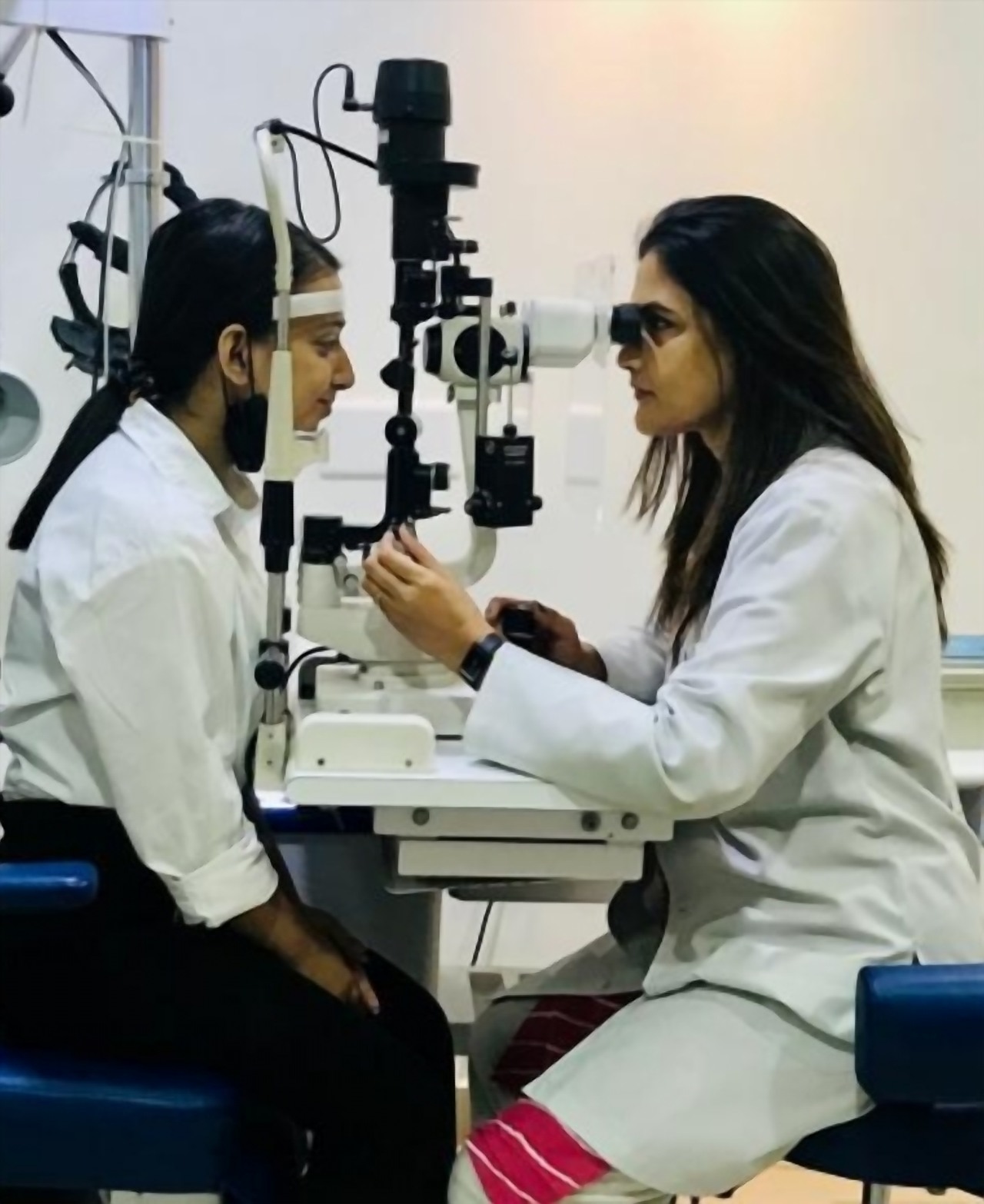 Dr. Rinku Das examining a patient at the slit lamp in her own clinic